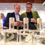 Benny Teal, left, talks with Bryan Karrick during the Giniology class at Scratch Distillery Saturday night in Edmonds on April 17, 2016. (Kevin Clark / The Herald)