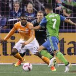 The Sounders&rsquo; Cristian Roldan makes a run at the goal with the Dynamo&rsquo;s Sheanon Williams (left) and Joe Willis (center) defending Wednesday night at Century Link Field in Seattle. (Kevin Clark / The Herald)