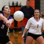 Lake Stevens&rsquo; Gabby Gunterman makes a dig as teammate Emily Lubick looks on during the Vikings&rsquo; five-set victory on Thursday night at Monroe. (Kevin Clark / The Herald)