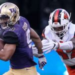 Washington&rsquo;s Myles Gaskin escapes a tackle attempt by Oregon State&rsquo;s Bright Ugwoegbu Saturday afternoon at Husky Stadium in Seattle. (Kevin Clark / The Herald)