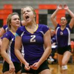 Lake Stevens&rsquo; Lilly Eason (center) celebrates as teammate Melissa Stevens (left) looks on during the Vikings&rsquo; five-set victory Thursday night at Monroe. (Kevin Clark / The Herald)