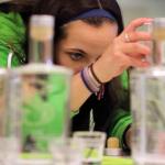 Corrissa Kellett mixes a custom Gin during the Giniology class at Scratch Distillery Saturday night in Edmonds on April 17, 2016. (Kevin Clark / The Herald)