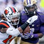 Washington&rsquo;s John Ross makes a catch with Oregon State&rsquo;s Treston Decoud attempting a tackle Saturday afternoon at Husky Stadium in Seattle on October 22, 2016. (Kevin Clark / The Herald