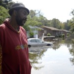 Zach Frailey / Daily Free Press                                William Murrell stands at the edge of his property, which is partially underwater, on Cedar Lane in Kinston, North Carolina, on Friday.