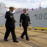 Patrick Semansky / Associated Press                                Capt. James Kirk (right), commanding officer of the USS Zumwalt walks past the ship to a news conference in Baltimore on Thursday.