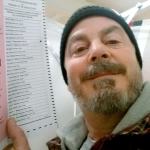 Bill Phillips, of Nashua, New Hampshire, takes a selfie with his marked election ballot during that state&rsquo;s primary in February. The secrecy of the voting booth may soon be a thing of the past. Ballot selfies, where people use smartphones to photograph and share their marked ballots online, are becoming more common, as voters young and old look to share their views with family, friends and the world. But what they don&rsquo;t realize is they may be breaking the law, depending on where they live. (Bill Phillips via AP)