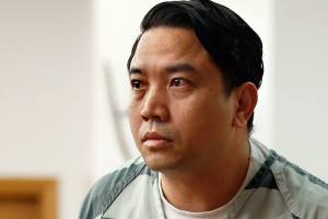 Bunthoeun Nem stands to go before the bench and be sentenced for the 2005 shooting death of Jessie Williams, Thursday morning at Snohomish County Superior Court. (Dan Bates / The Herald)