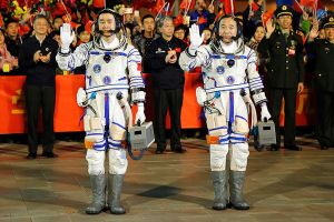 China launches manned mission to experimental space station