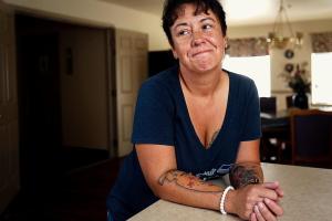 Stacy Mooney visits the kitchen and dining room in the Women&rsquo;s Shelter of the Everett Gospel Mission where she stayed with all six of her children during a recent time of extreme difficulty. (Dan Bates / The Herald)