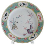 This Meissen Kakiemon-style plate auctioned for $6,500. It was made about 1740 and has the crossed swords mark in blue. (Cowles Syndicate)