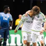 Sounders&rsquo; Osvaldo Alonso (second from right) celebrates his goal against the Whitecaps with teammate Erik Friberg (right) during the first half of their game Sunday in Vancouver, British Columbia. (The Canadian Press / Ben Nelms)