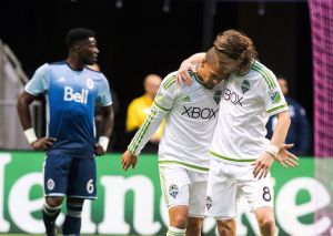 Sounders veteran defender Zach Scott is honored with the Golden Scarf Award before a match against Real Salt Lake on Sunday, in Seattle. Scott is retiring at the end of the 2016 season. (AP Photo/Ted S. Warren)