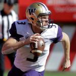 Washington quarterback Jake Browning (3) rolls out as he looks down field in the first half of a game against Utah this past Saturday in Salt Lake City. (AP Photo/Rick Bowmer)