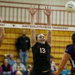 Monroe&rsquo;s Samantha Zimmerman (13) and Sophia Barber (14) go up for a block against Lake Stevens&rsquo; Hannah Aaenson during the 4A District 1 championship game Thursday at Marysville Pilchuck High School. (Ian Terry / The Herald)