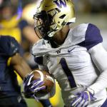 Washington&rsquo;s John Ross (right) runs on his way for a touchdown against California&rsquo;s Chibuzo Nwokocha during the first half of a game Saturday in Berkeley, Calif. (AP Photo/Ben Margot)