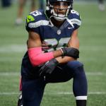 Seahawks wide receiver Doug Baldwin kneels during warm-ups before a game against the Falcons on Oct. 16 in Seattle. (AP Photo/Elaine Thompson)