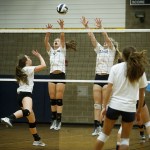 Arlington players (from left) Reese Talbot, Mary Catherine Meno and Madison Burkett practice at the school on Wednesday. Arlington will face off against Bellevue in the first round of the 3A state volleyball tournament in Kennewick on Friday. (Ian Terry / The Herald)