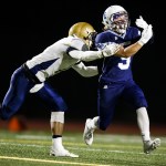 A pass sails through the outstretched arms of Meadowdale&rsquo;s Haelin Roberts (right) as Kelso&rsquo;s River Liepa defends during a first round 3A state playoff game Friday at Edmonds Stadium. (Ian Terry / The Herald)