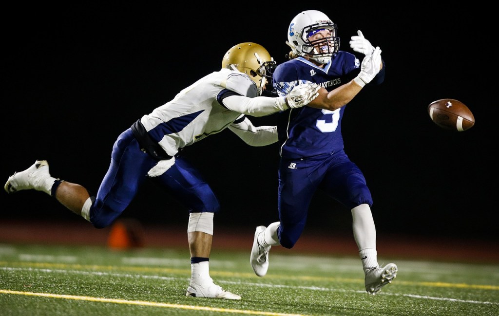 A pass sails through the outstretched arms of Meadowdale&rsquo;s Haelin Roberts (right) as Kelso&rsquo;s River Liepa defends during a first round 3A state playoff game Friday at Edmonds Stadium. (Ian Terry / The Herald)