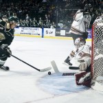 Silvertips left wing Dominic Zwerger (left) shoots the puck during Everett&rsquo;s 6-1 win over Calgary on Tuesday at Xfinity Arena in Everett. (Ian Terry / The Herald)