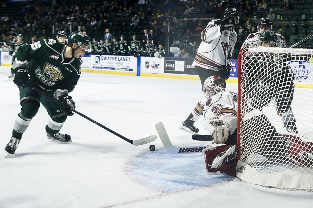 Silvertips left wing Dominic Zwerger (left) shoots the puck during Everett&rsquo;s 6-1 win over Calgary on Tuesday at Xfinity Arena in Everett. (Ian Terry / The Herald)