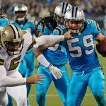 The Panthers&rsquo; Luke Kuechly (59) runs past the Saints&rsquo; Thomas Morstead (6) as he returns a blocked field-goal attempt in the first half of a game Thursday in Charlotte, N.C. (AP Photo/Mike McCarn)