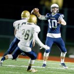 Meadowdale quarterback Drew Tingstad throws as he is pursued by a pair of Kelso defenders during a first-round 3A state playoff game at Edmonds Stadium on Nov. 11. Tingstad leads the Mavericks into a quarterfinal matchup with Peninsula on Friday. (Ian Terry / The Herald)