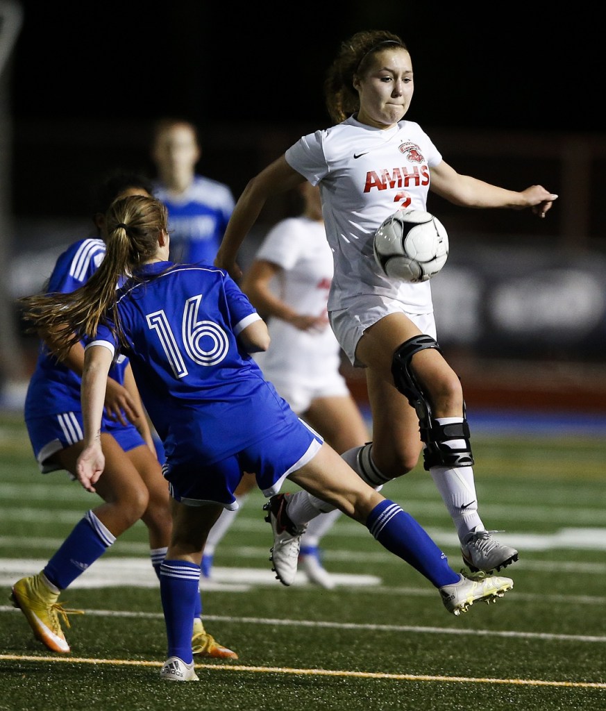 Archbishop Murphy&rsquo;s Caroline Adams (right) moves the ball past Liberty&rsquo;s Jillian Haffner (left) during a 2A state semifinal at Shoreline Stadium on Friday. Liberty went on to defeat the Wildcats 6-2. (Ian Terry / The Herald)