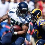 Seahawks running back Thomas Rawls (34) carries the ball during the first half a game against the Rams on Sept. 18 in Los Angeles. (AP Photo/Kelvin Kuo)