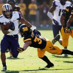 Washington&rsquo;s Myles Gaskin (9) breaks away from Arizona State&rsquo;s Jordan Simone (38) during the first half of a game Nov. 14, 2015, in Tempe, Ariz. (AP Photo/Ross D. Franklin)