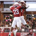 Washington State running back Gerard Wicks (23) celebrates with running back Jamal Morrow after Wicks scored a touchdown during the first half of a game against California on Nov. 12 in Pullman. (AP Photo/Young Kwak)