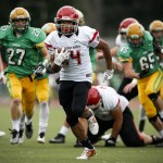 Archbishop Murphy&rsquo;s Anfernee Gurley (center) sprints down field for a touchdown during a 2A state playoff game against Tumwater at Tumwater High School on Saturday. (Ian Terry / The Herald)