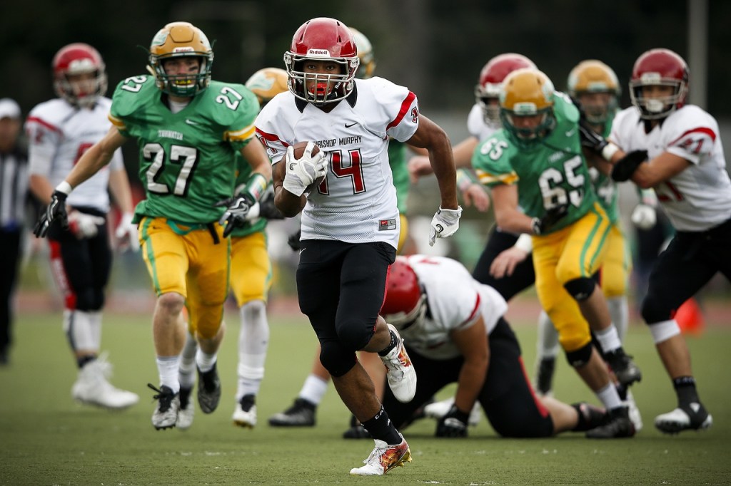 Archbishop Murphy&rsquo;s Anfernee Gurley (center) sprints down field for a touchdown during a 2A state playoff game against Tumwater at Tumwater High School on Saturday. (Ian Terry / The Herald)