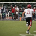 Archbishop Murphy fans react to an interception returned for a touchdown by Collin Montez (21) during a 2A state playoff game against Tumwater at Tumwater High School on Saturday. (Ian Terry / The Herald)