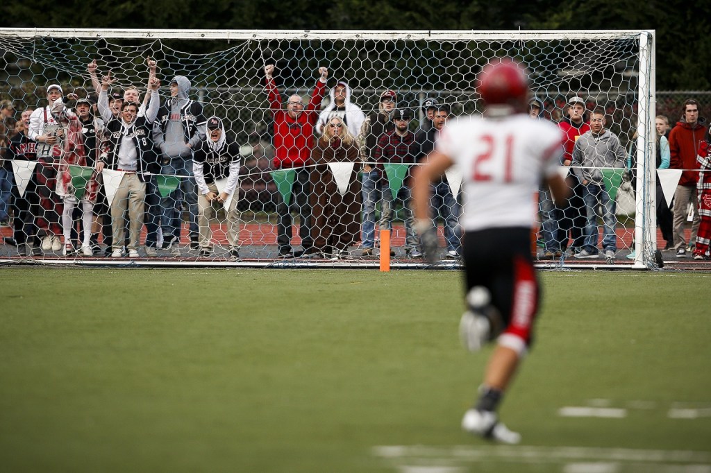 Archbishop Murphy fans react to an interception returned for a touchdown by Collin Montez (21) during a 2A state playoff game against Tumwater at Tumwater High School on Saturday. (Ian Terry / The Herald)