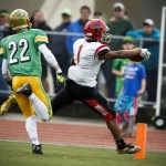 Archbishop Murphy&rsquo;s Kyler Gordon (1) reaches across the goal line for a touchdown as Tumwater&rsquo;s Jakob Holbrook (22) defends during a 2A state playoff game at Tumwater High School on Saturday. (Ian Terry / The Herald)