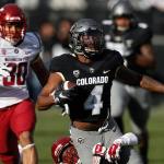 Colorado wide receiver Bryce Bobo (front) is pulled down after catching a pass for a long gain by Washington State cornerback Treshon Broughton as defensive lineman Nnamdi Oguayo trails the play in the first half Saturday in Boulder, Colo. (AP Photo/David Zalubowski)