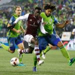 Sounders defender Roman Torres (right) challenges Rapids forward Dominique Badji (center), during the first leg of the MLS soccer Western Conference championship Tuesday in Seattle. (AP Photo/Ted S. Warren)