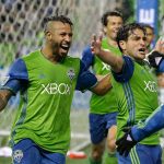 Sounders forward Nicolas Lodeiro (right) celebrates with Tyrone Mears (left) after Lodeiro scored a goal against the Rapids during the first leg of the MLS soccer Western Conference finals Tuesday in Seattle. (AP Photo/Ted S. Warren)