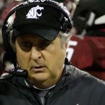 Washington State head coach Mike Leach walks from a huddle during the first half of a game against UCLA on Oct. 15 in Pullman. (AP Photo/Young Kwak)