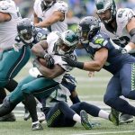 Philadelphia&rsquo;s Wendell Smallwood runs the ball as Seattle&rsquo;s Bobby Wagner (54) moves to make the tackle during the Seahawks&rsquo; win over tht Eagles last Sunday in Seattle. (AP Photo/Stephen Brashear)