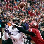 Washington wide receiver John Ross makes a touchdown reception over Washington State&rsquo;s Darrien Molton during the Apple Cup on Friday in Pullman. (Kevin Clark / The Herald)