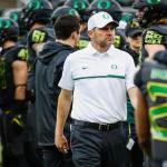 Oregon head coach Mark Helfrich watches his players before a game against Stanford on Nov. 12 in Eugene, Ore. After a disappointing 4-8 season, Oregon fired Helfrich on Tuesday. (AP Photo/Thomas Boyd)