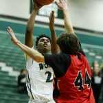 Jackson&rsquo;s Islim Ouldtaki (left) takes a shot as Snohomish&rsquo;s Nolan Armbruster defends during a game Tuesday at Jackson High School. (Ian Terry / The Herald)