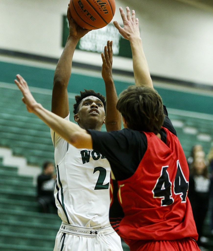 Jackson&rsquo;s Islim Ouldtaki (left) takes a shot as Snohomish&rsquo;s Nolan Armbruster defends during a game Tuesday at Jackson High School. (Ian Terry / The Herald)