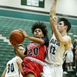 Snohomish&rsquo;s Darius Johnson (left) goes up for a shot as Jackson&rsquo;s Brock Peterson (right) defends during a game Tuesday at Jackson High School. (Ian Terry / The Herald)