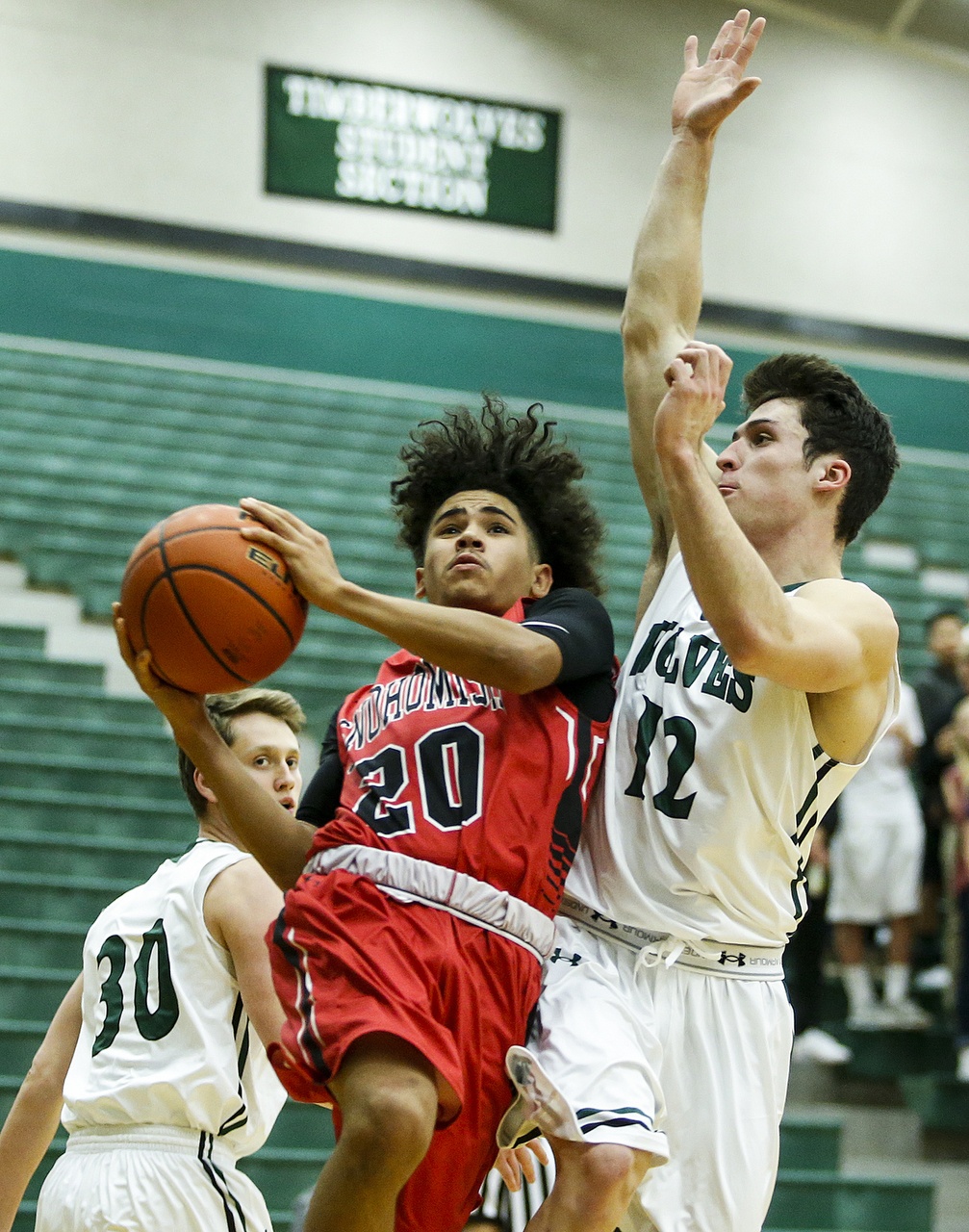 Snohomish&rsquo;s Darius Johnson (left) goes up for a shot as Jackson&rsquo;s Brock Peterson (right) defends during a game Tuesday at Jackson High School. (Ian Terry / The Herald)