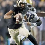 David Zalubowski / Associated Press                                Colorado quarterback Sefo Liufau, a Tacoma native, runs for a short gain with UCLA defensive lineman Takkarist McKinley in pursuit during a game Nov. 3 in Boulder, Colo.