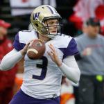 Washington quarterback Jake Browning looks for an open receiver in the first half of the Huskies&rsquo; game against Washington State on Nov. 25. (AP Photo/Ted S. Warren)