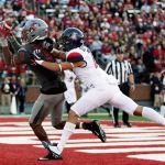 Young Kwak / Associated Press                                Washington State wide receiver Tavares Martin Jr. (8) catches a pass for a touchdown while defended by Arizona cornerback Jace Whittaker during the second half of Saturday&rsquo;s game.